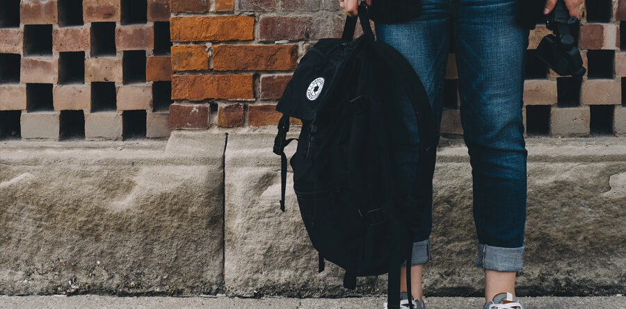 Photo of person holding a large backpack